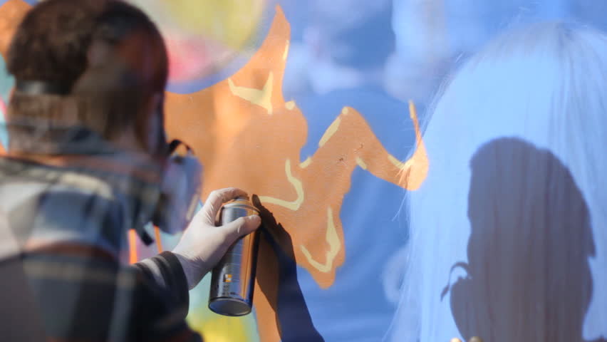 Graffiti art Wall,Artist spraying the wall color painting