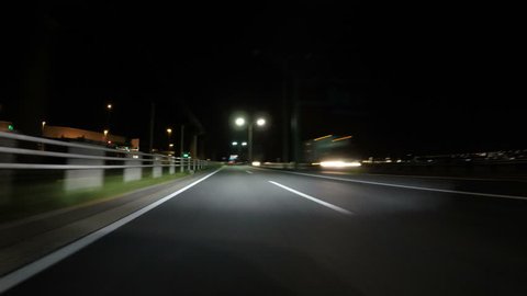 POV nightlapse through the industrial city lights of Tokyo.