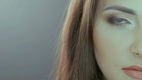 Video portrait of half face of beautiful woman