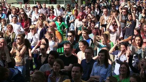 MOSCOW, RUSSIA - MAY 09, 2015: Crowd of fans screaming and applauding. Festival of marching bands in the city Park "Muzeon".