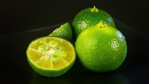 Close up rotation heap of the green limes 4K